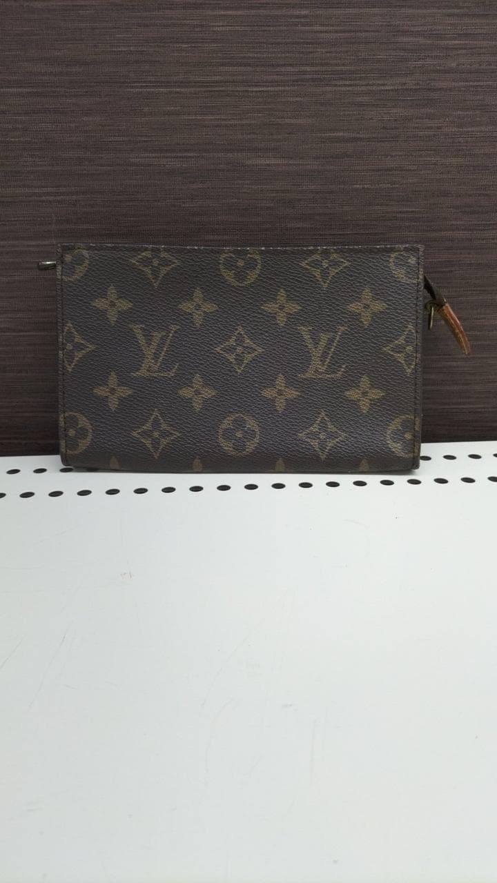 Monogram Pouch – Shows signs of wear on the inside